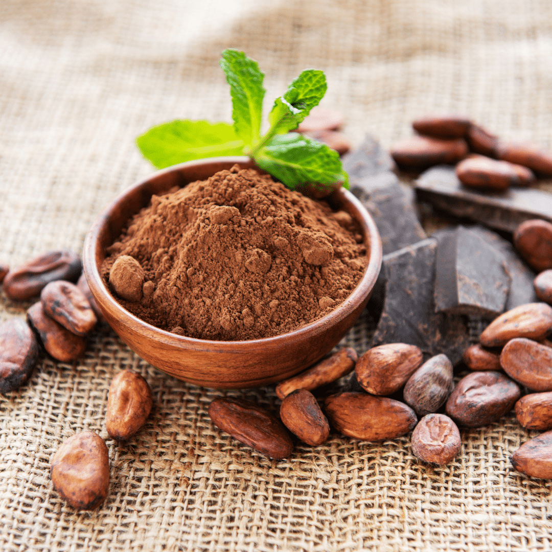 Photography of cocoa beans, cocoa powder, and dark chocolate. All of them contain caffeine.