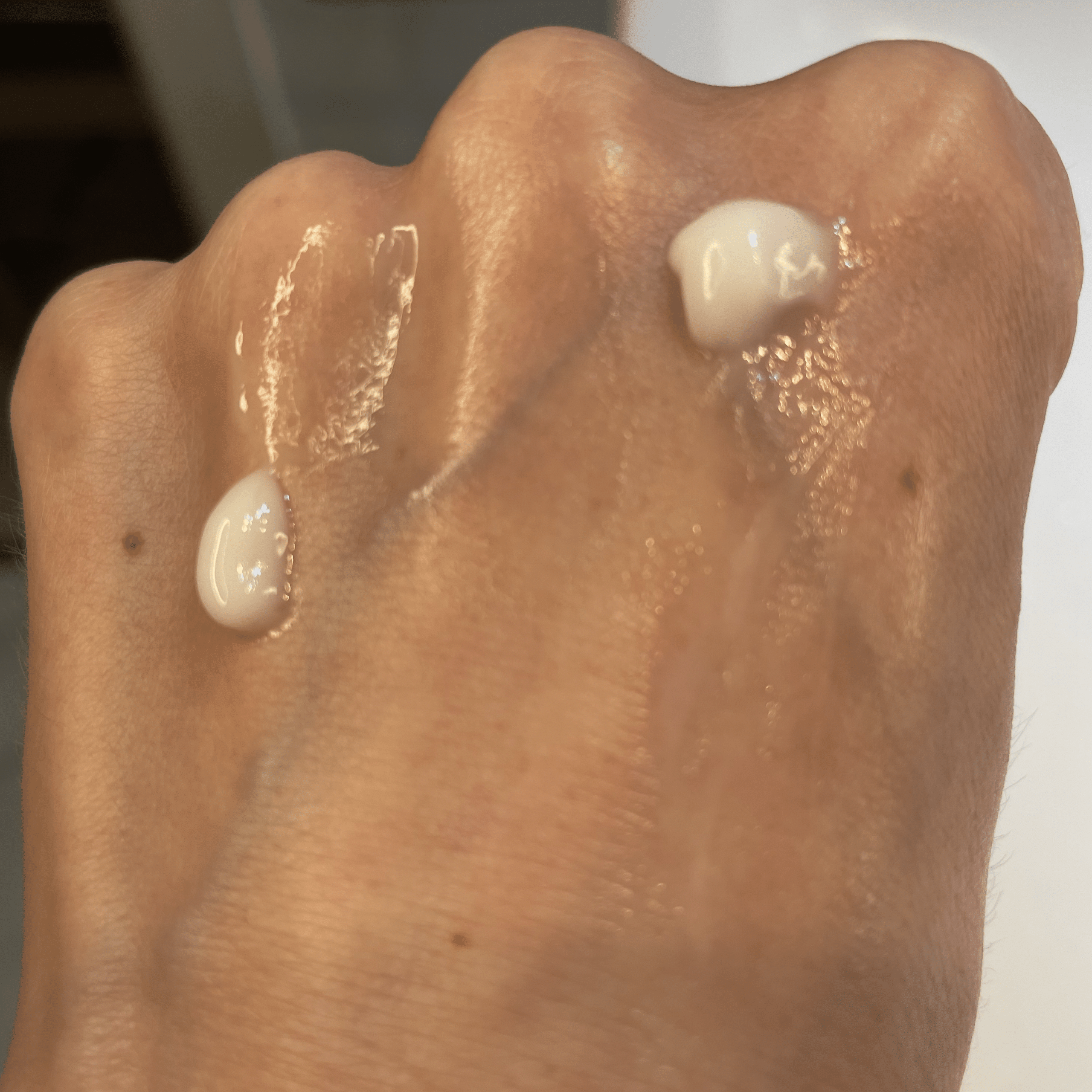 Texture of Omega Water Cream (left; dewy finish) and CeraVe PM (right; matte finish) on my skin.