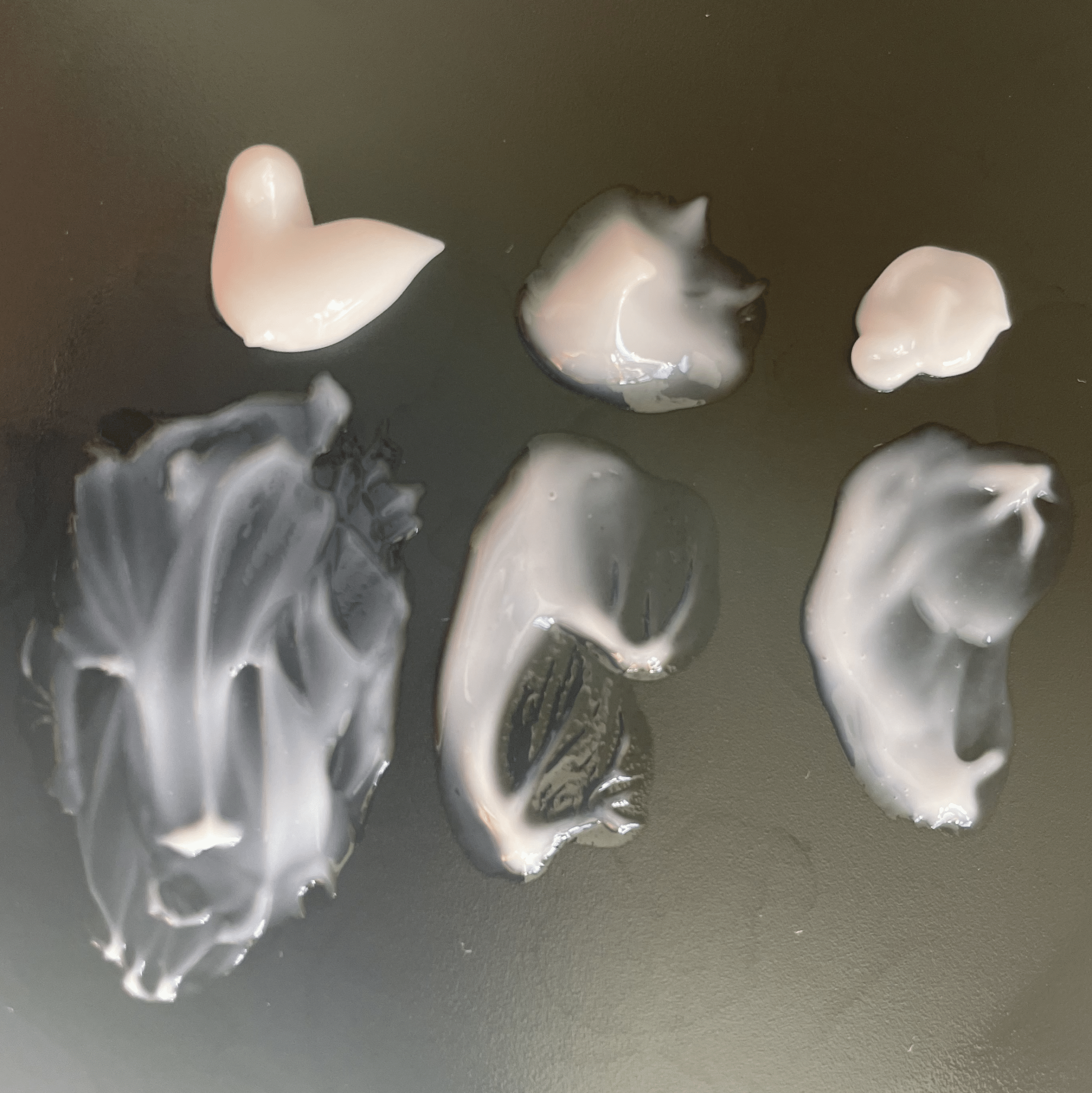 Photograph: texture of the Omega Water Cream (left), the Biossance Gel (center), and CeraVe PM Lotion (right).