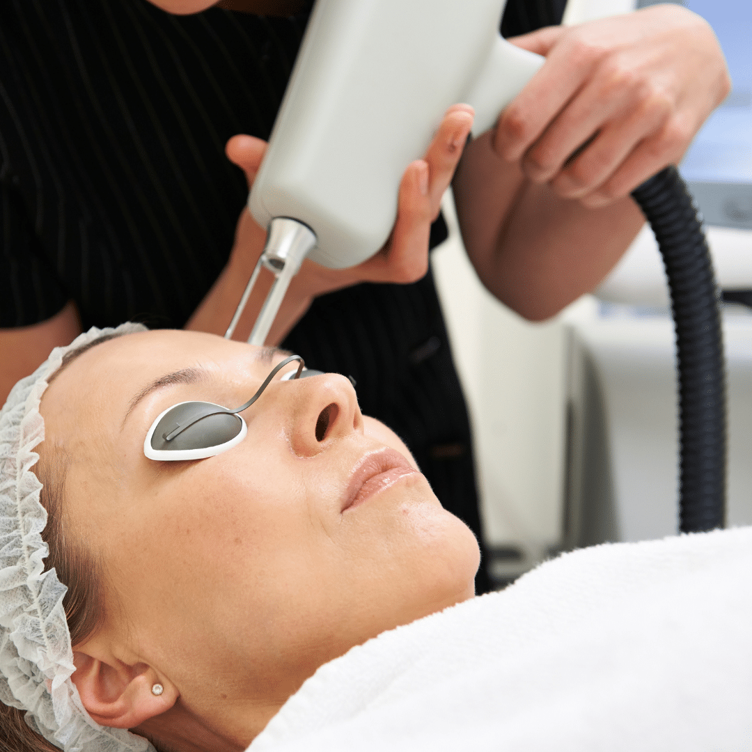 Photograph of a woman undergoing a laser treatment.