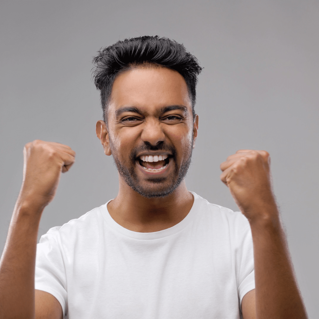 Photograph of a man celebrating victory: my combined treatment with tranexamic acid was a success.